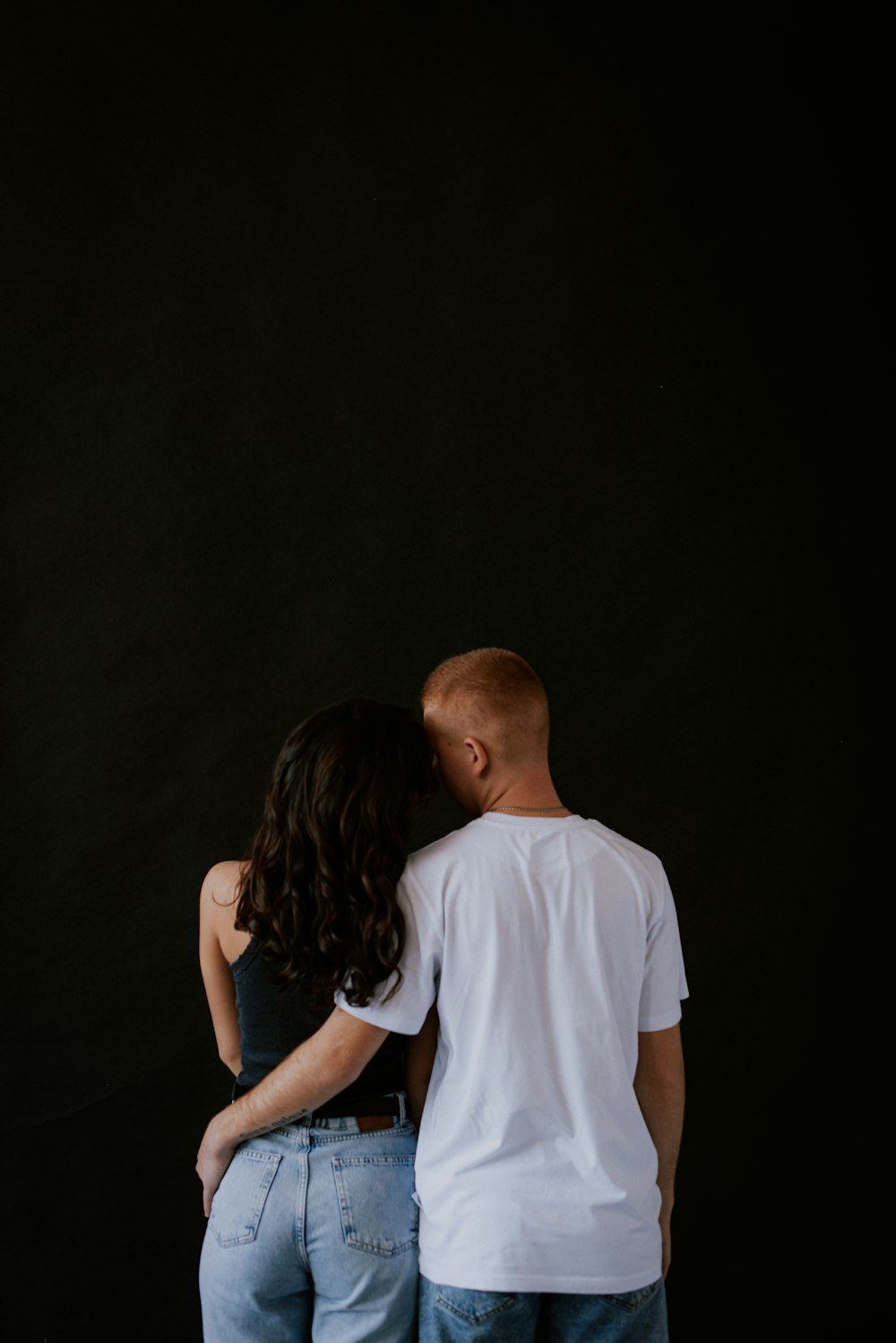 a man and a woman standing next to each other