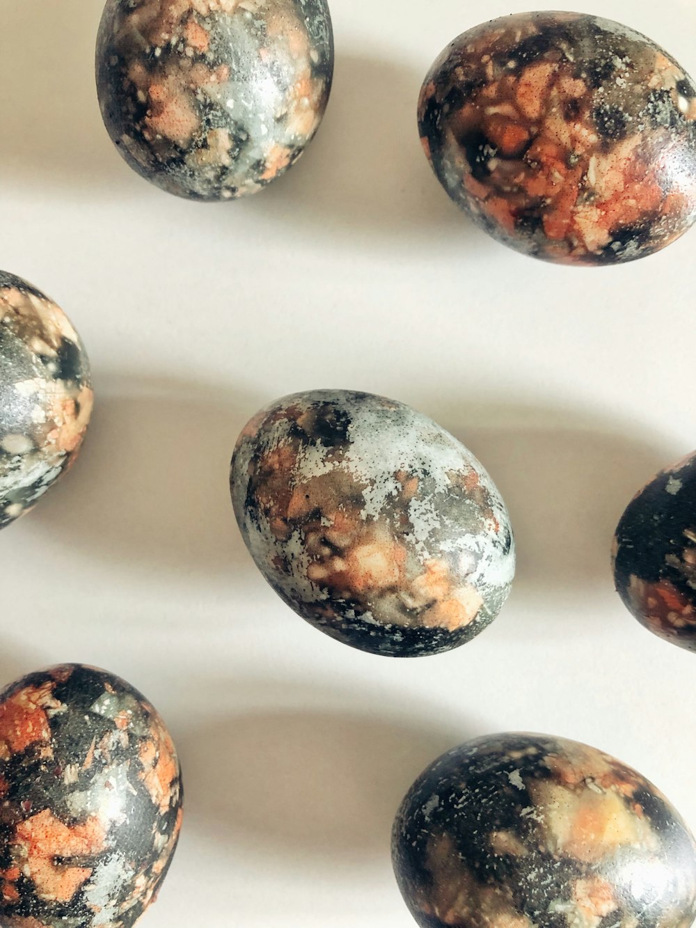 a group of marbles sitting on top of a table