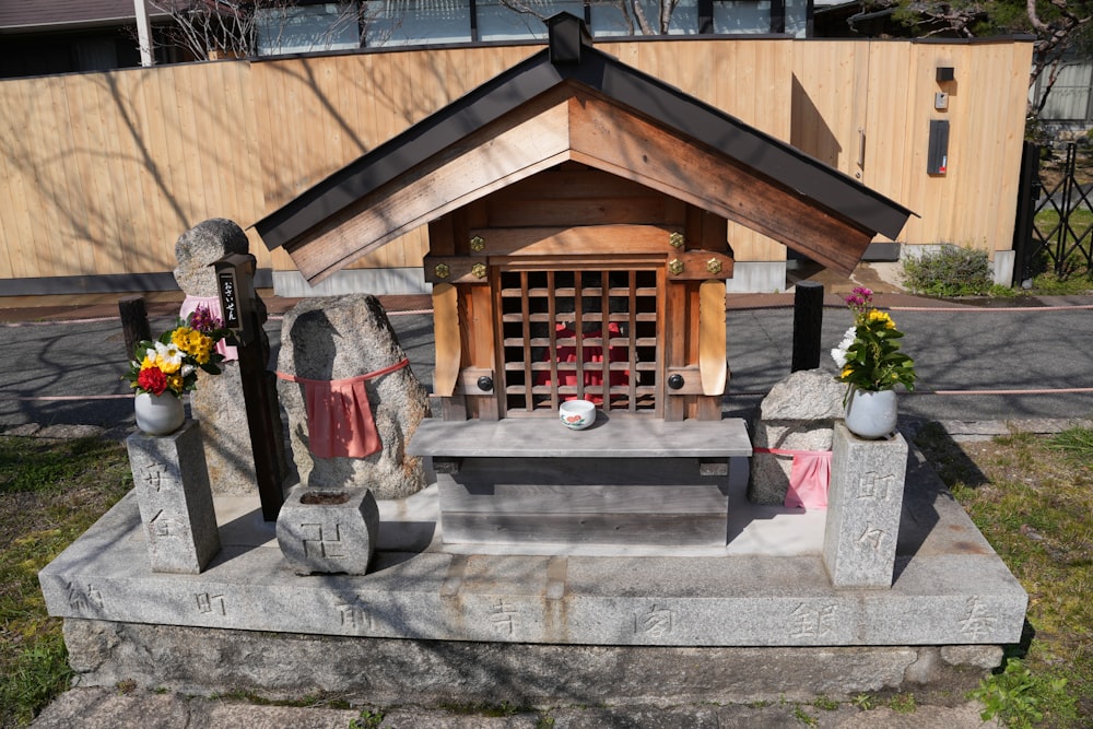 a small shrine with flowers and candles on it