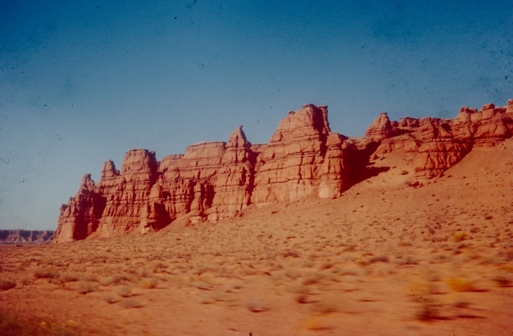 a group of rocks in the middle of a desert