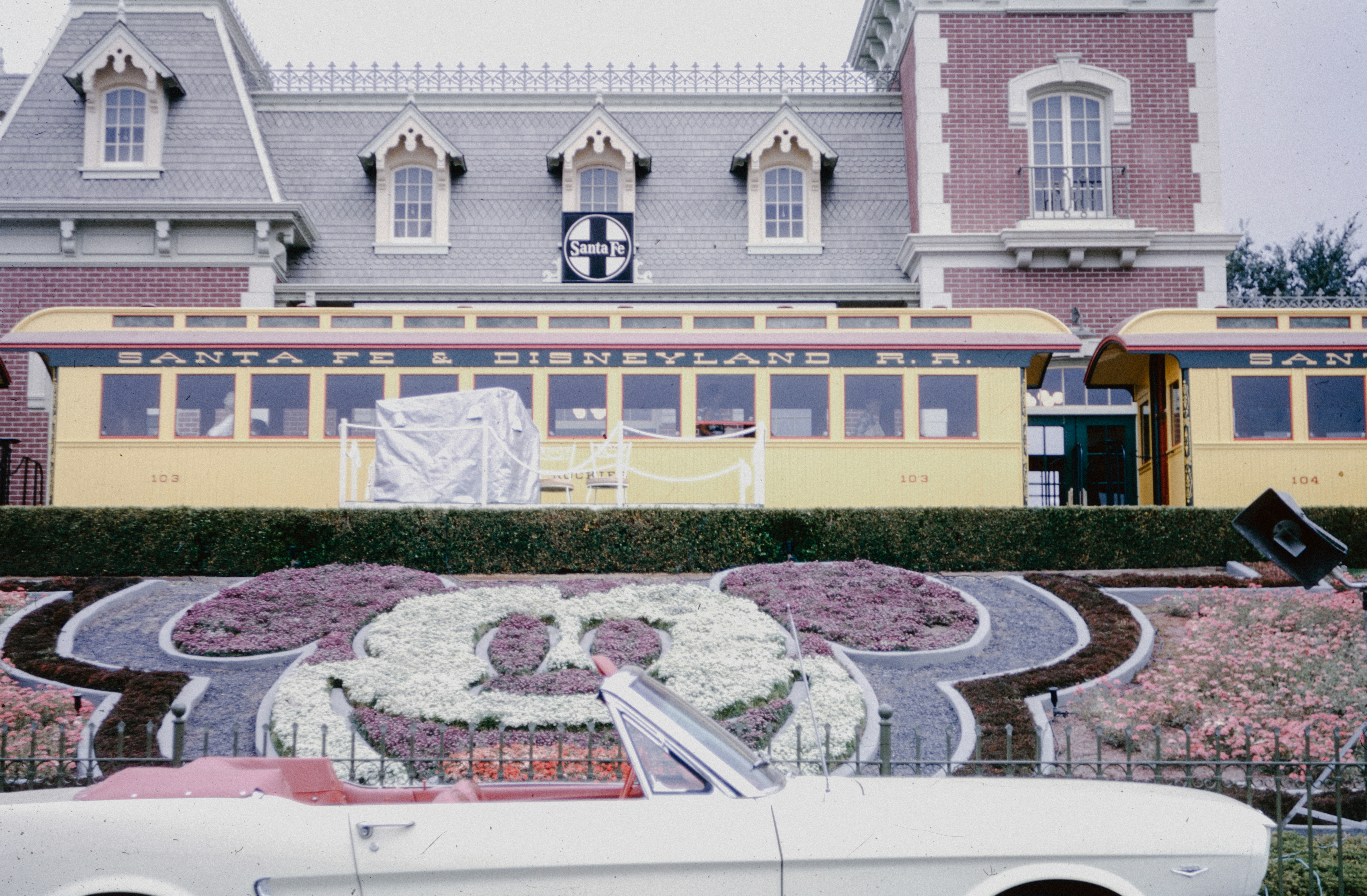 a white car parked in front of a building