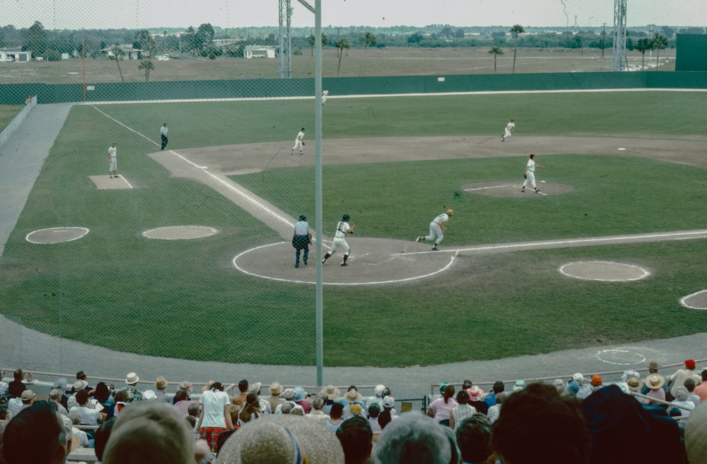 a crowd of people watching a baseball game