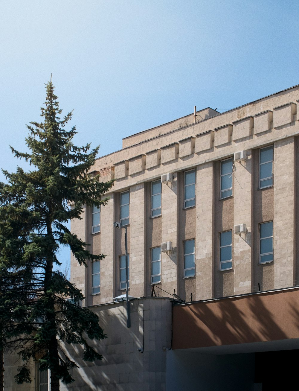 a tall building with a clock on the front of it