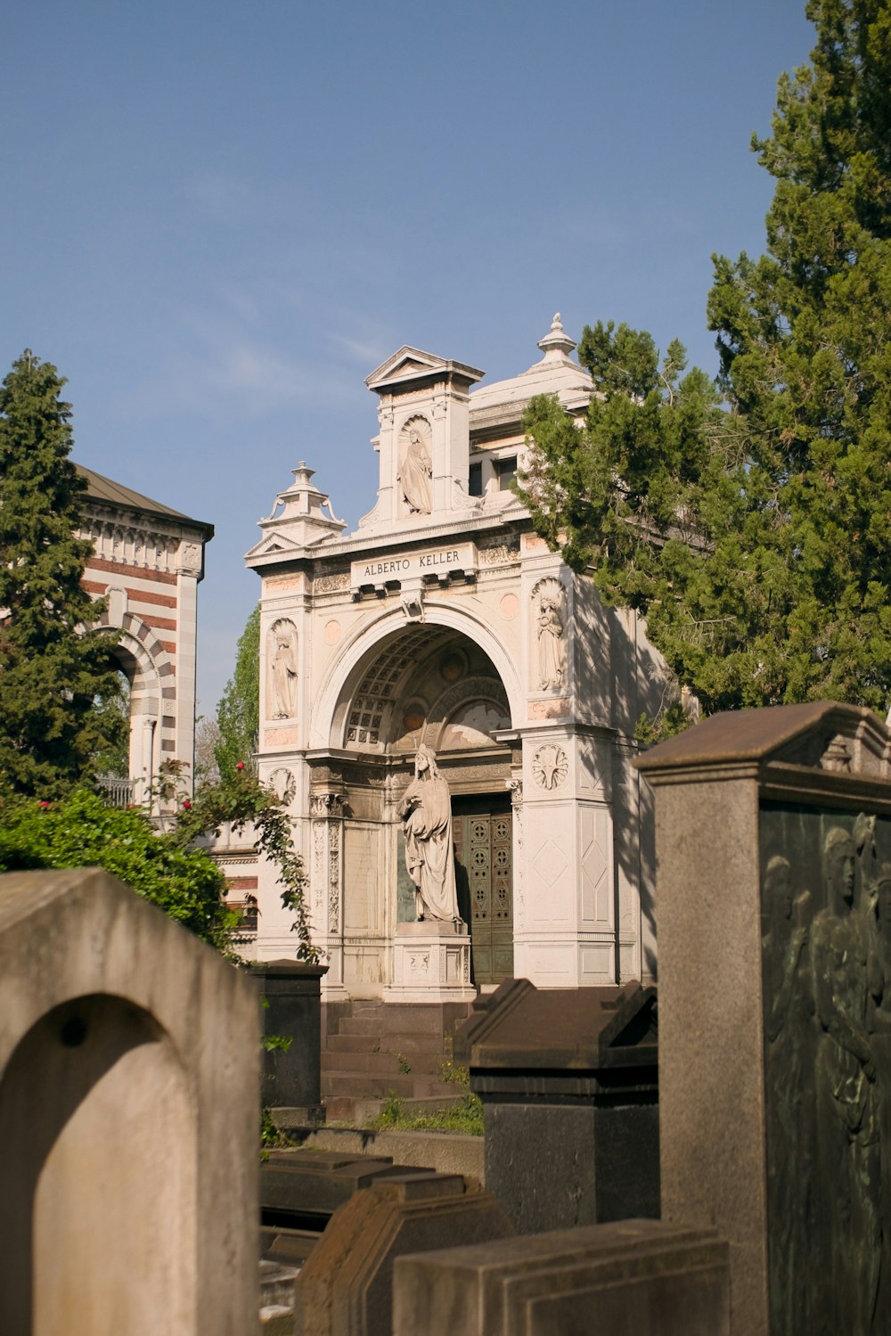 a cemetery with a statue of a man on it