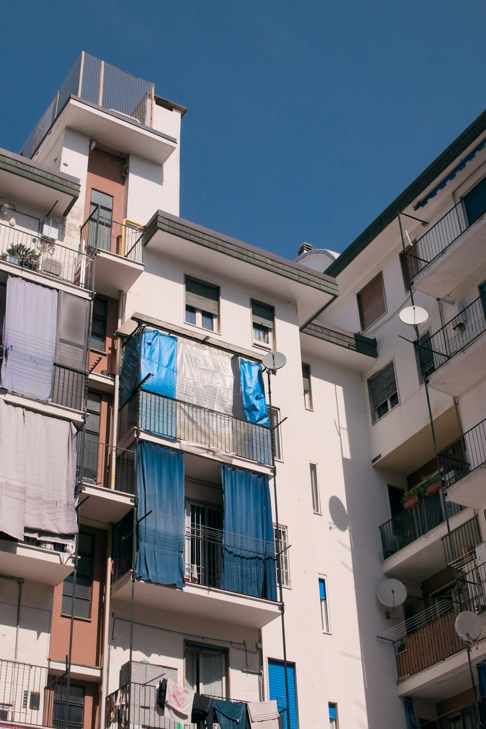 a tall building with balconies and balconies on the balconies