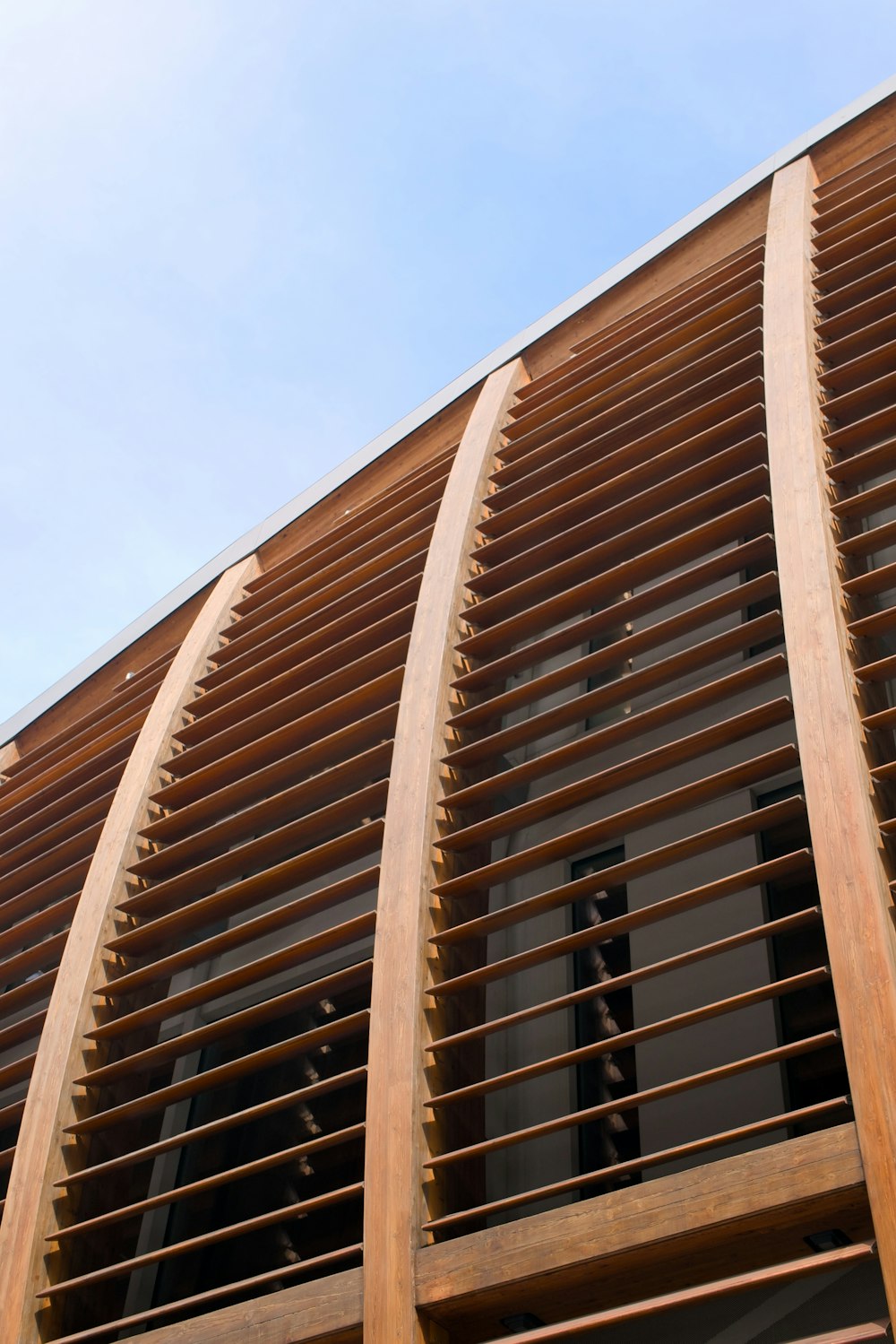 a close up of a building with wooden slats