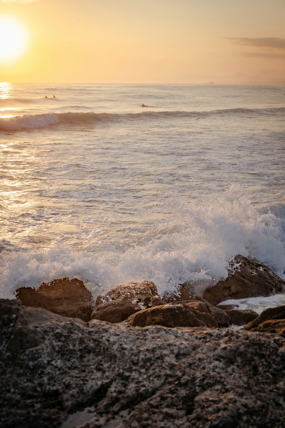 a person riding a surfboard on a wave in the ocean