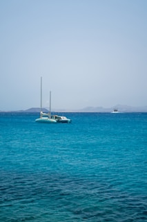 a boat floating on top of a large body of water