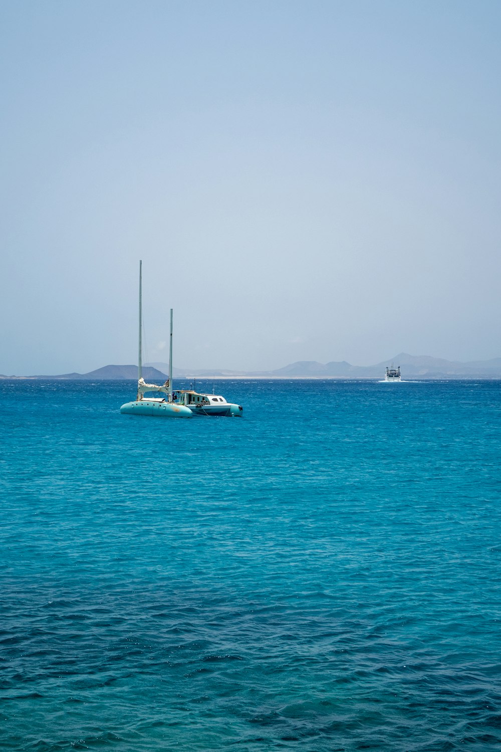 a boat floating on top of a large body of water