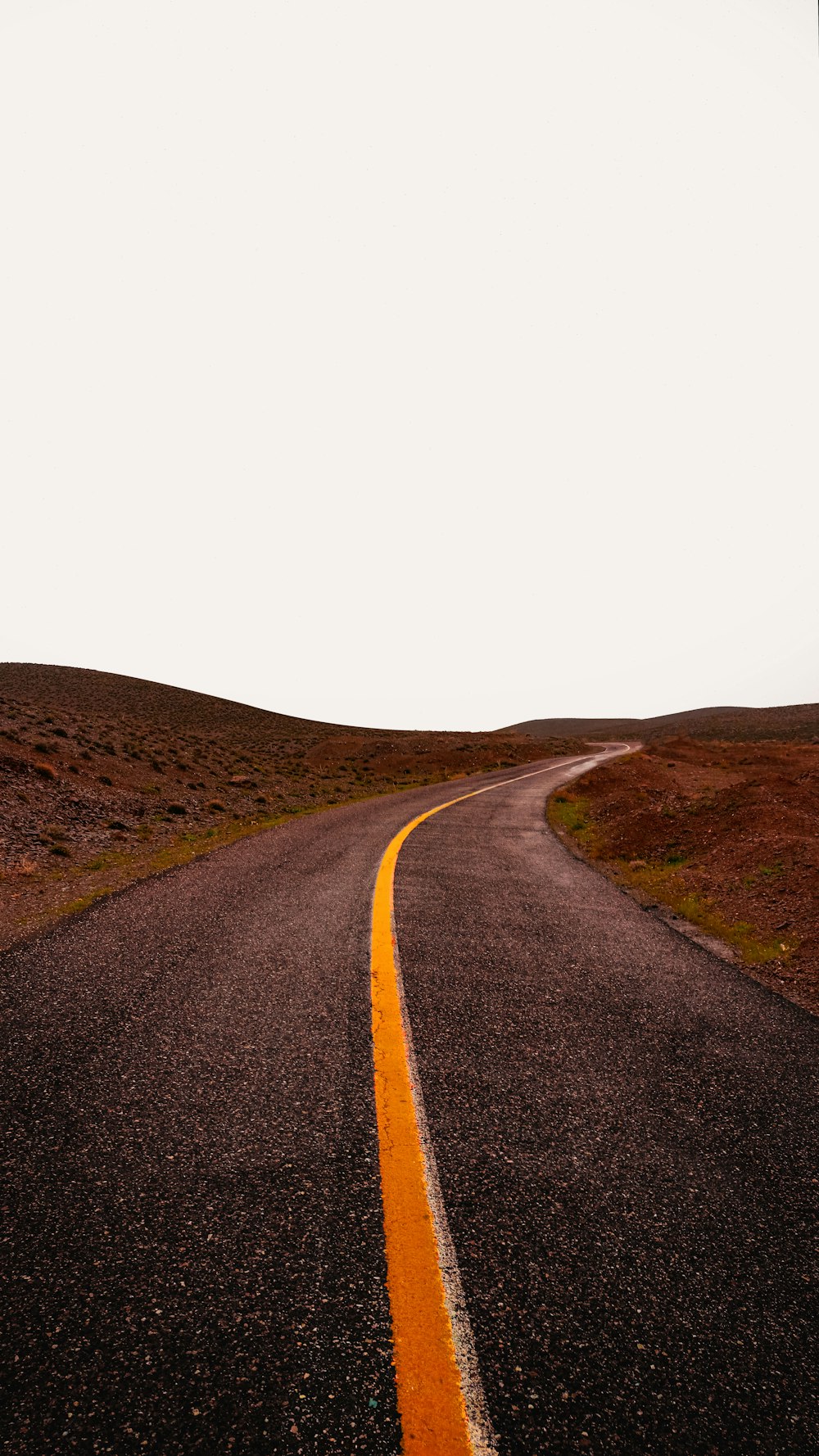 an empty road in the middle of nowhere