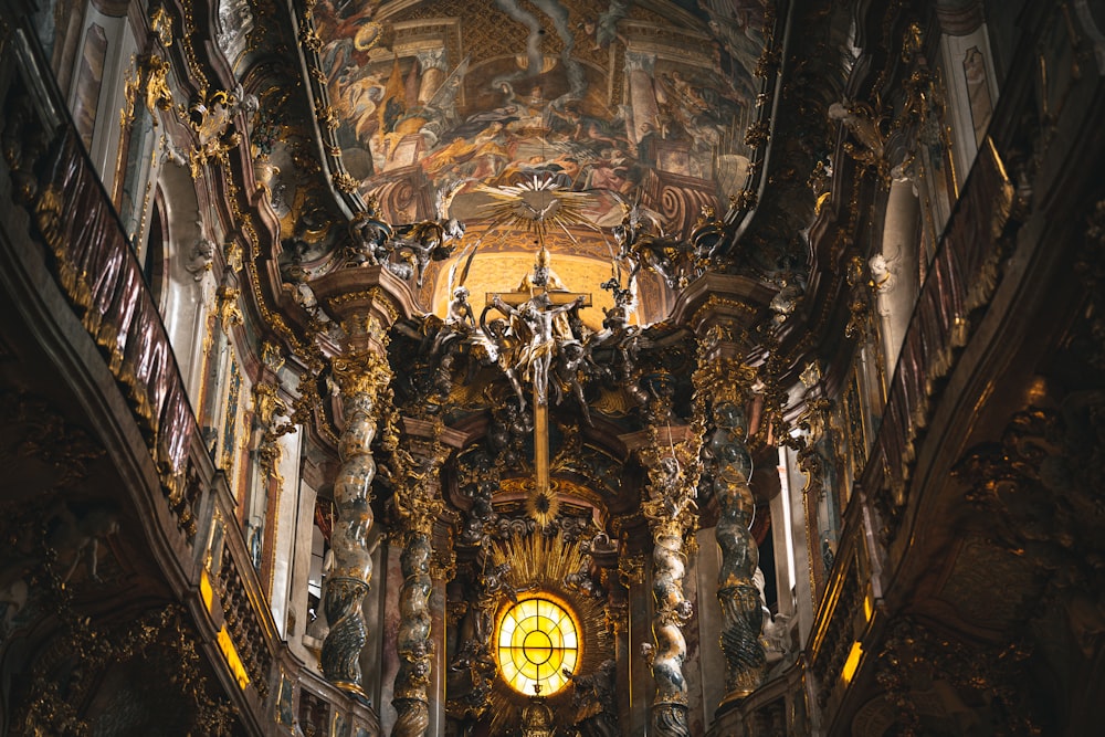 a church with a stained glass window in the ceiling