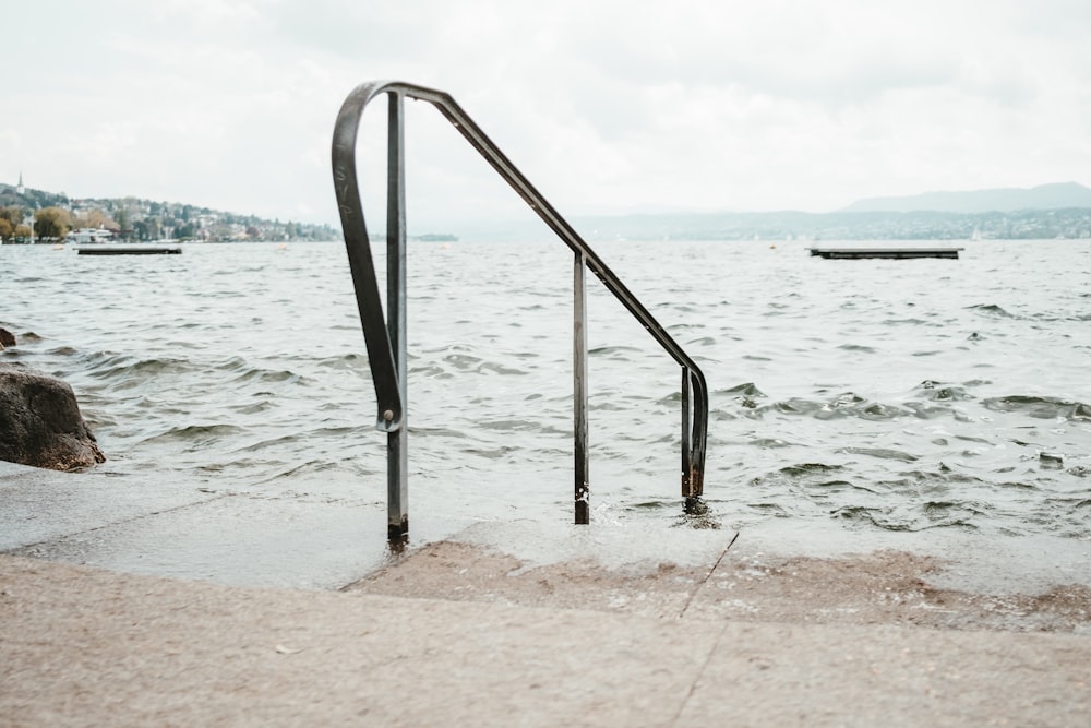 a set of stairs leading to a body of water