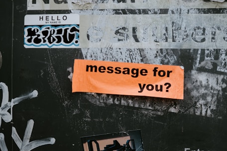 a sign on a wall that says message for you?
