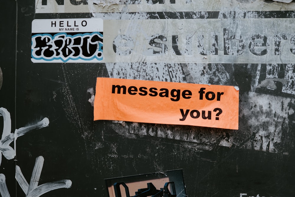 a sign on a wall that says message for you?