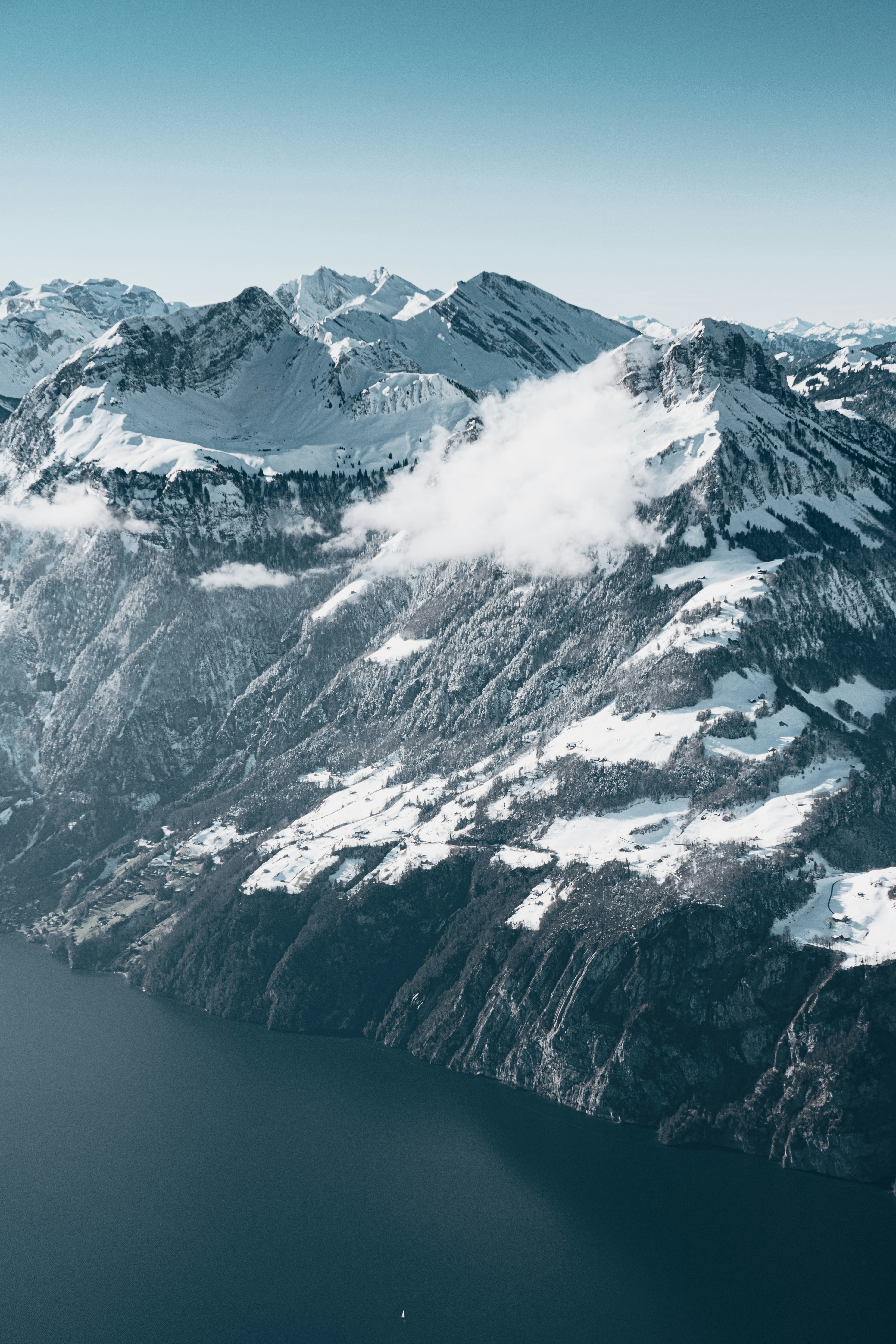 An aerial view of a snow covered mountain range photo – Free Grey Image ...