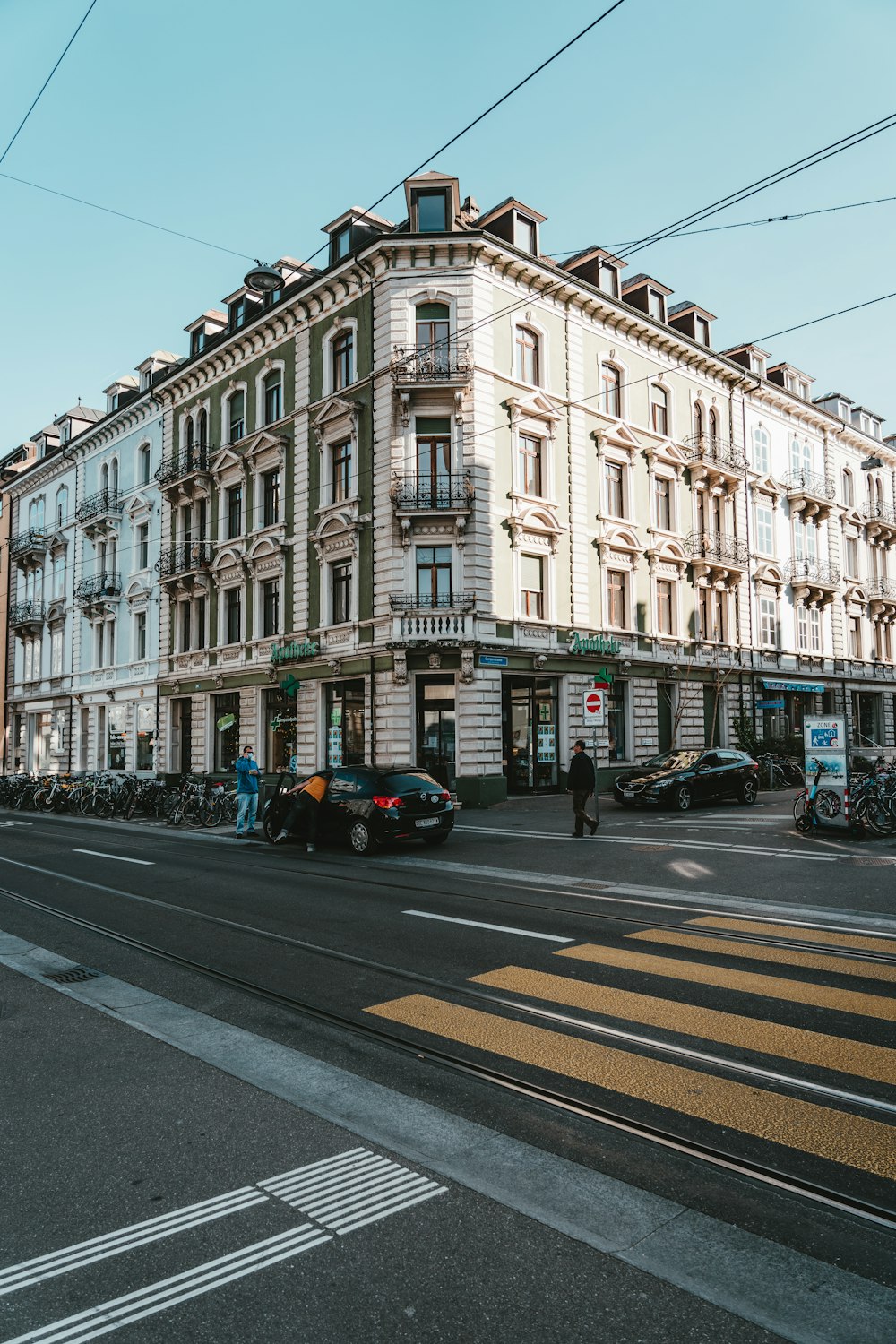 a very tall building sitting on the side of a road