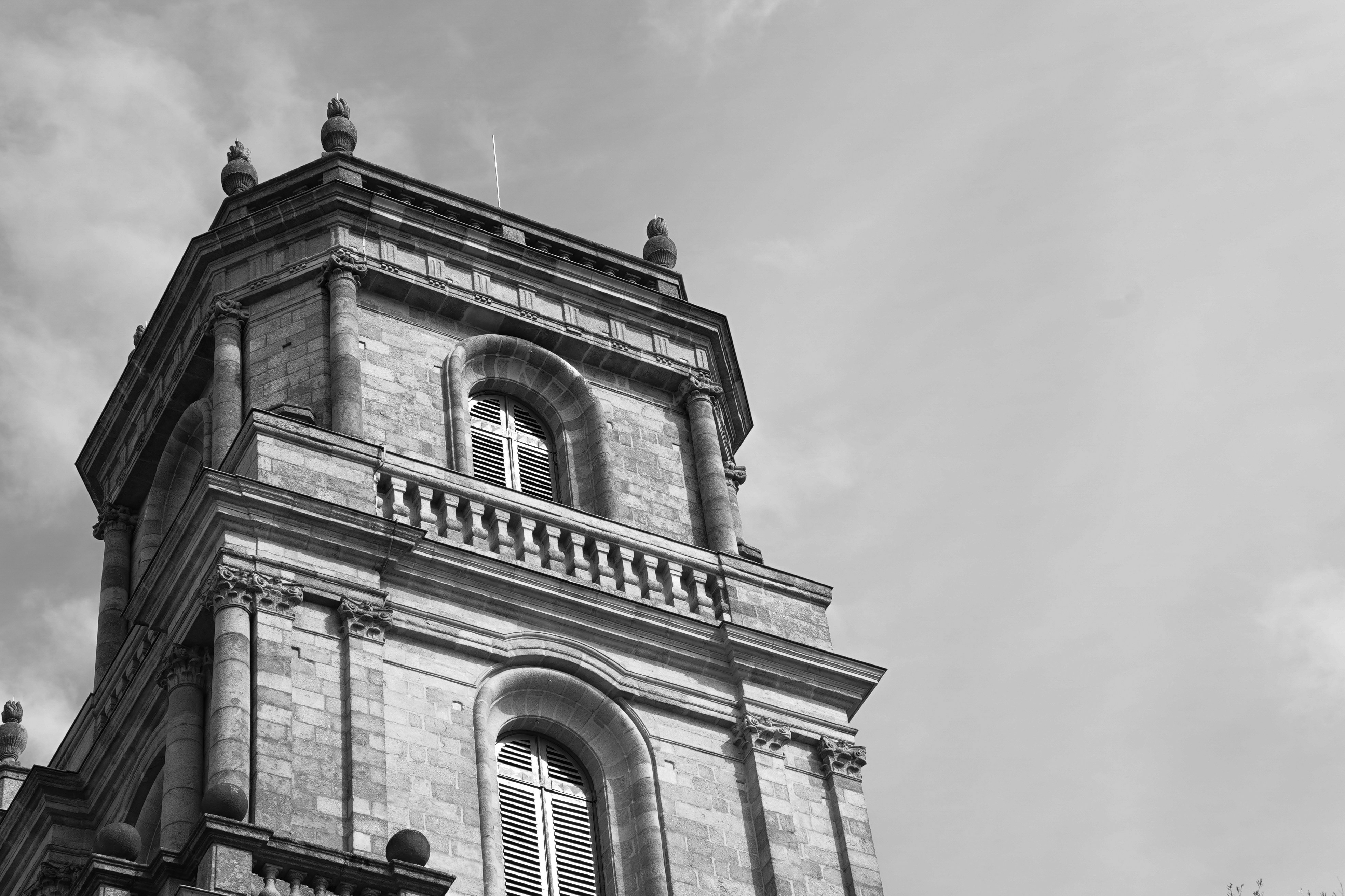 a black and white photo of a clock tower