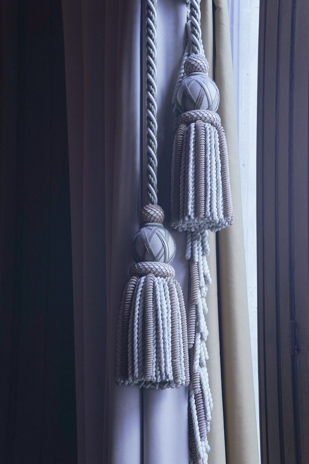 a curtain with two tassels hanging from it