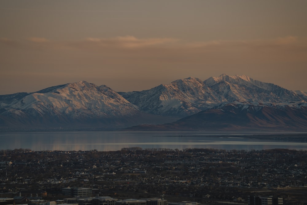 a view of a mountain range with a body of water in the foreground