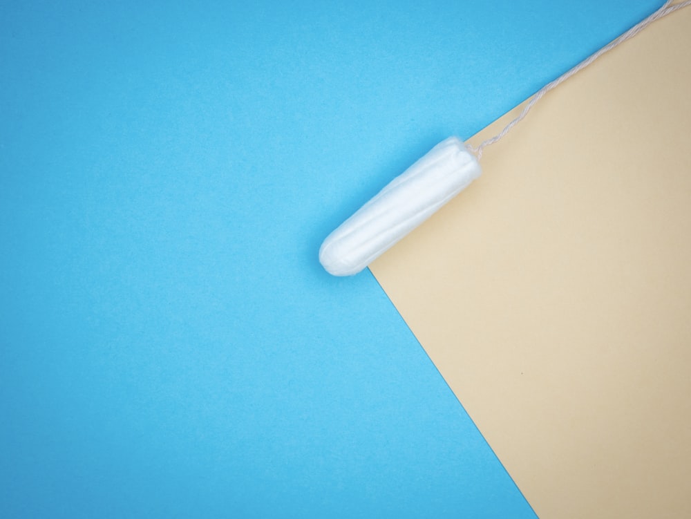 a piece of brown paper with a white object on top of it