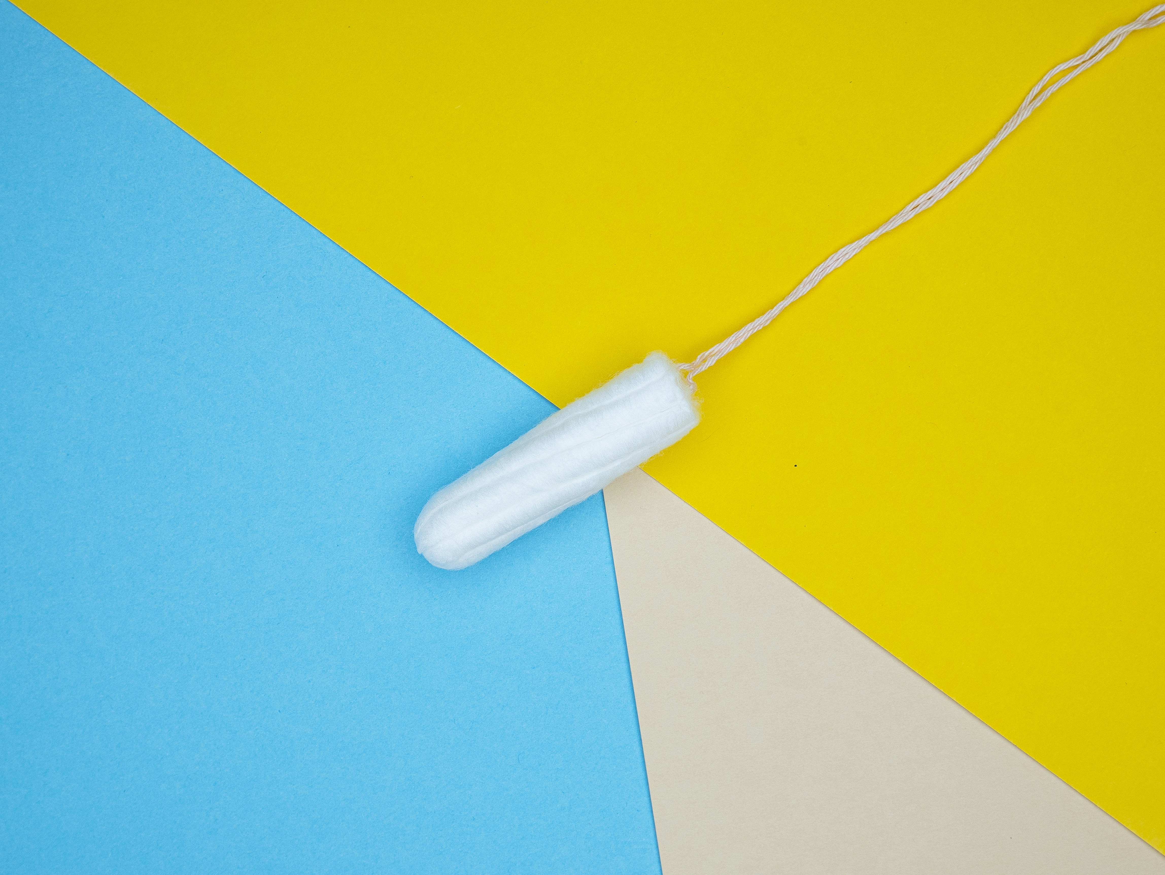 a white object on a yellow and blue background