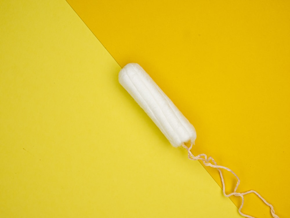 a white toothbrush on a yellow and yellow background