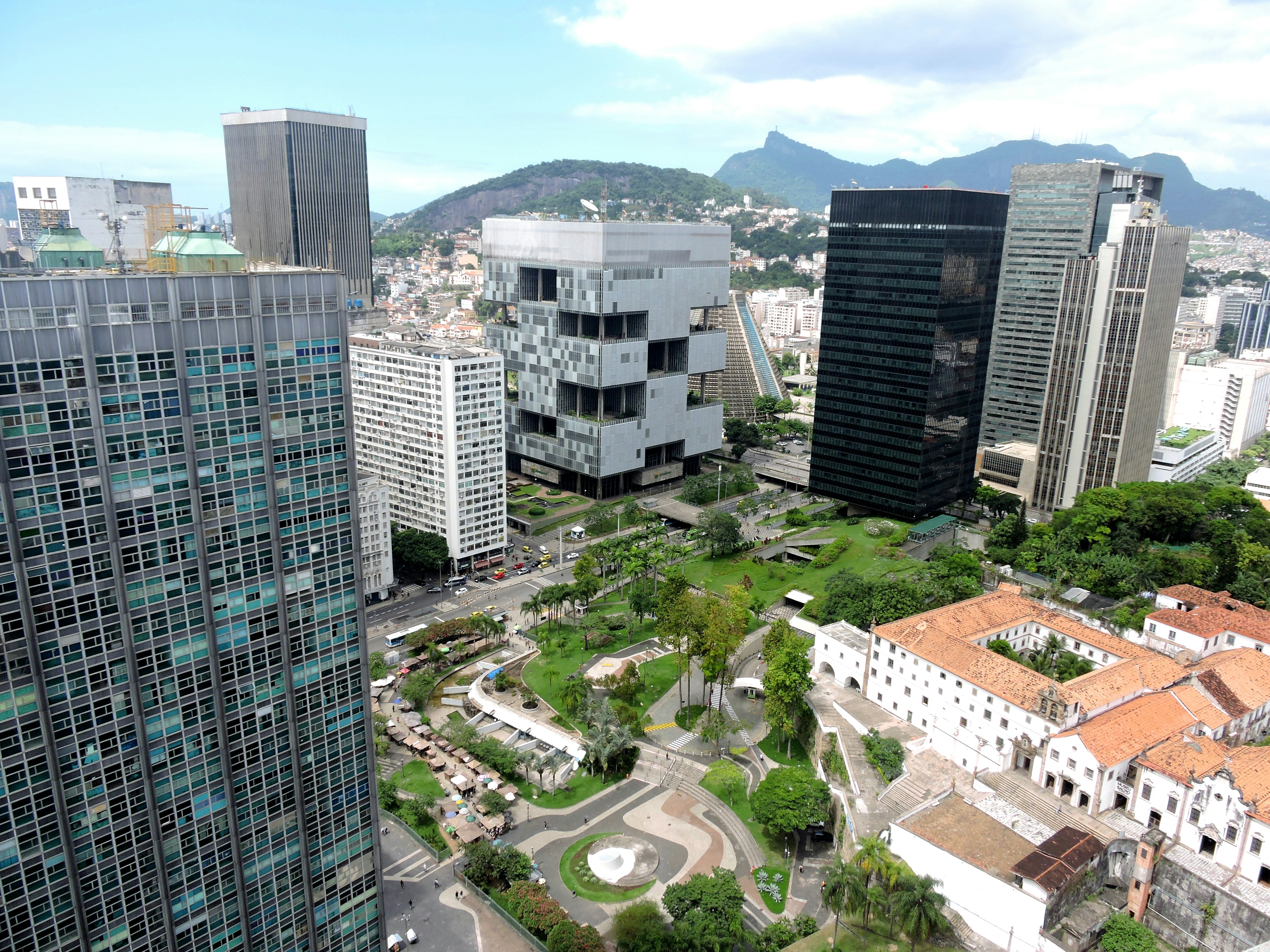 an aerial view of a city with tall buildings