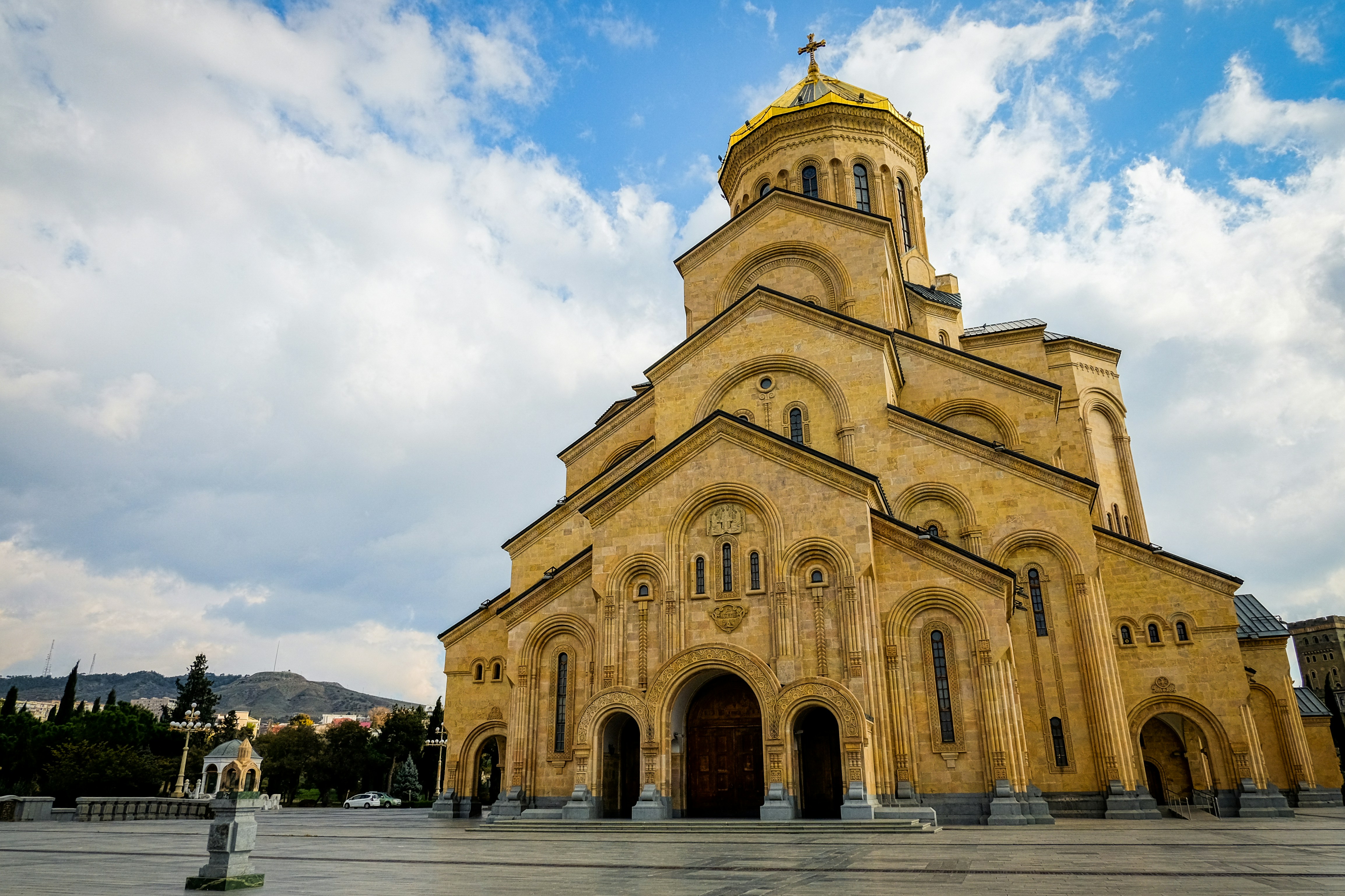 a large church with a golden roof and steeple