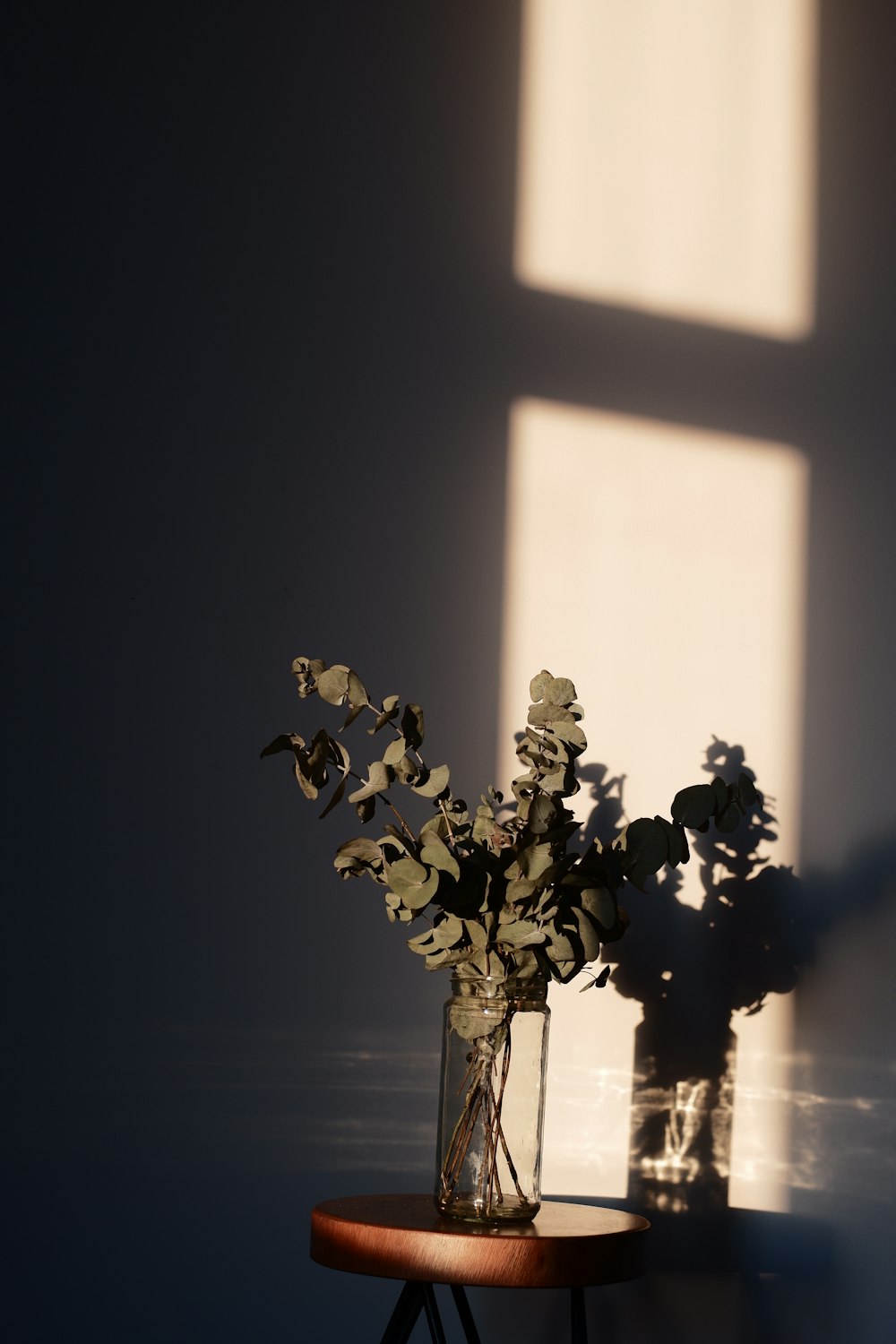 a vase filled with flowers sitting on top of a table