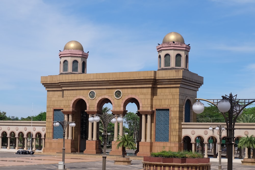 a large building with two gold domes on top of it