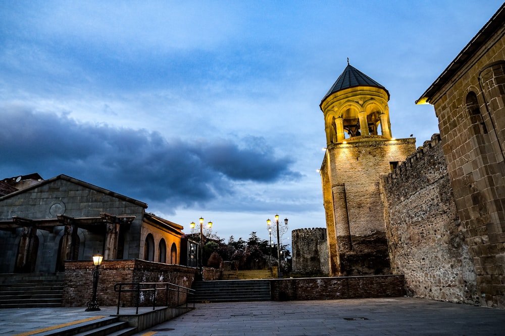 an old building with a clock tower in the background