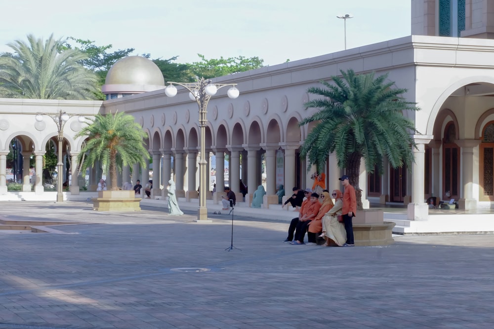 a group of people standing in front of a building