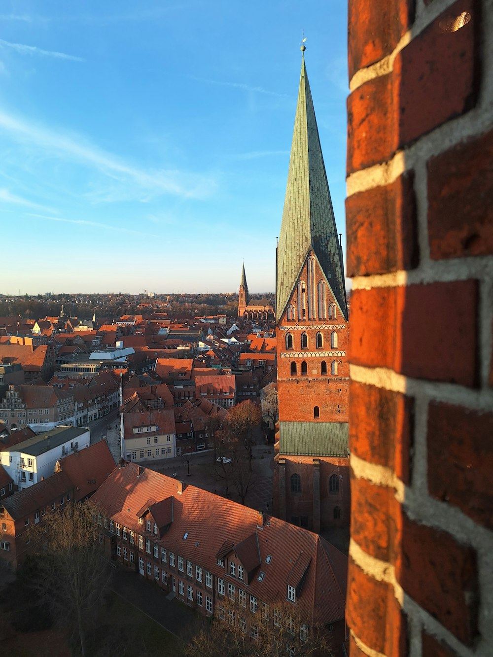 a view of a city from a brick wall