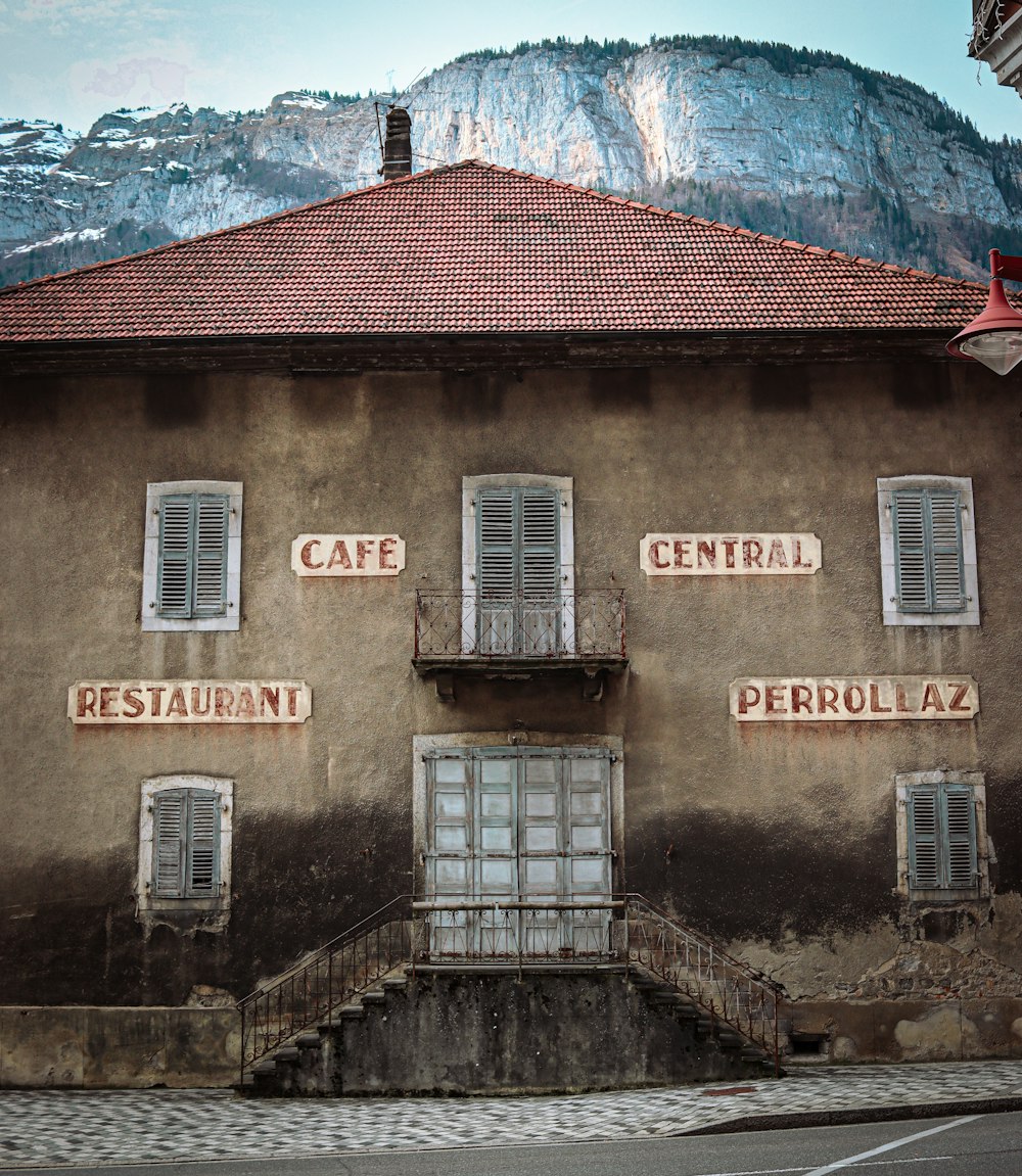 an old building with several windows and signs on the side of it