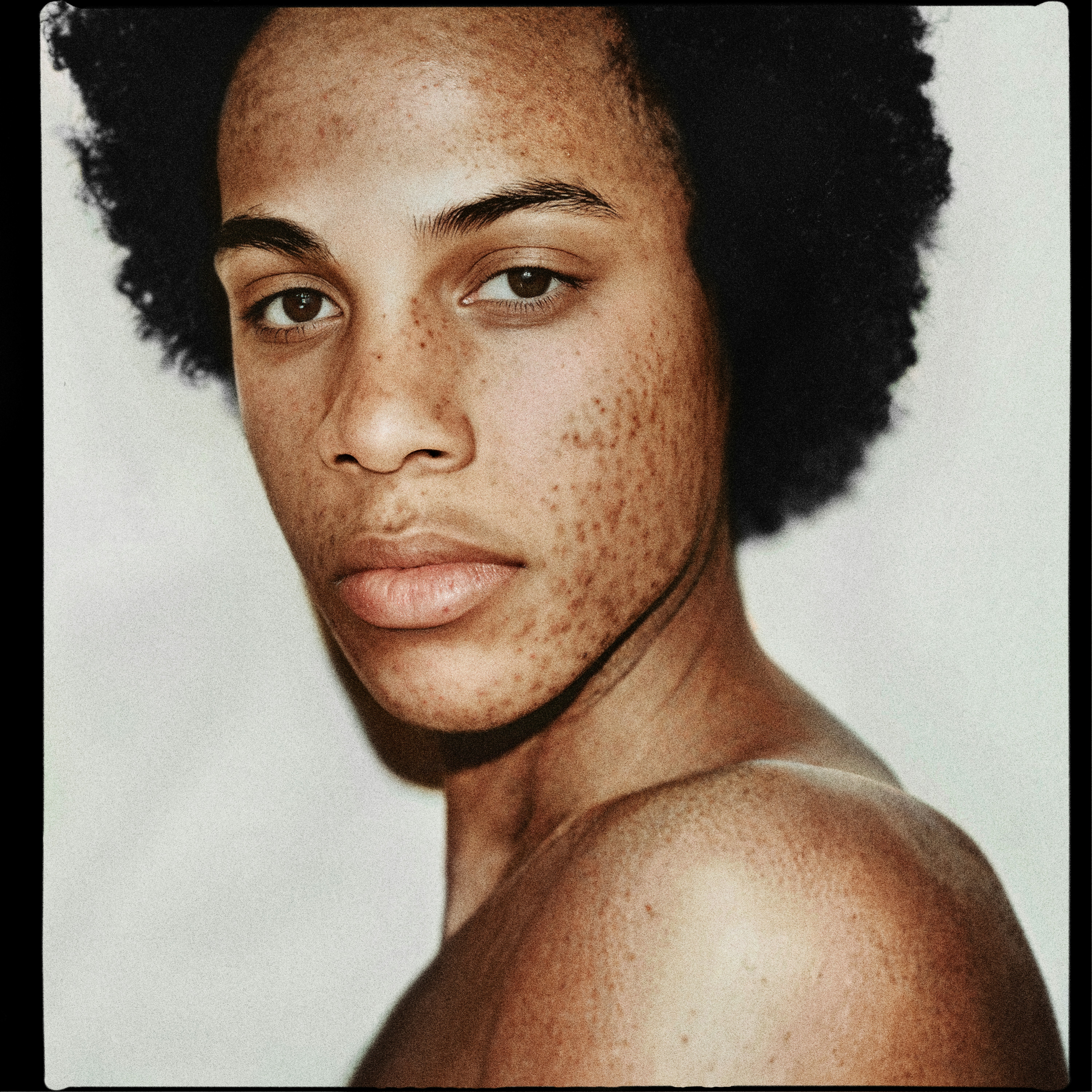 Ai generated portrait of a freckled model with bare shoulders