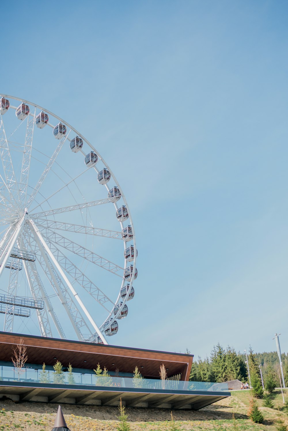 a large ferris wheel on top of a building