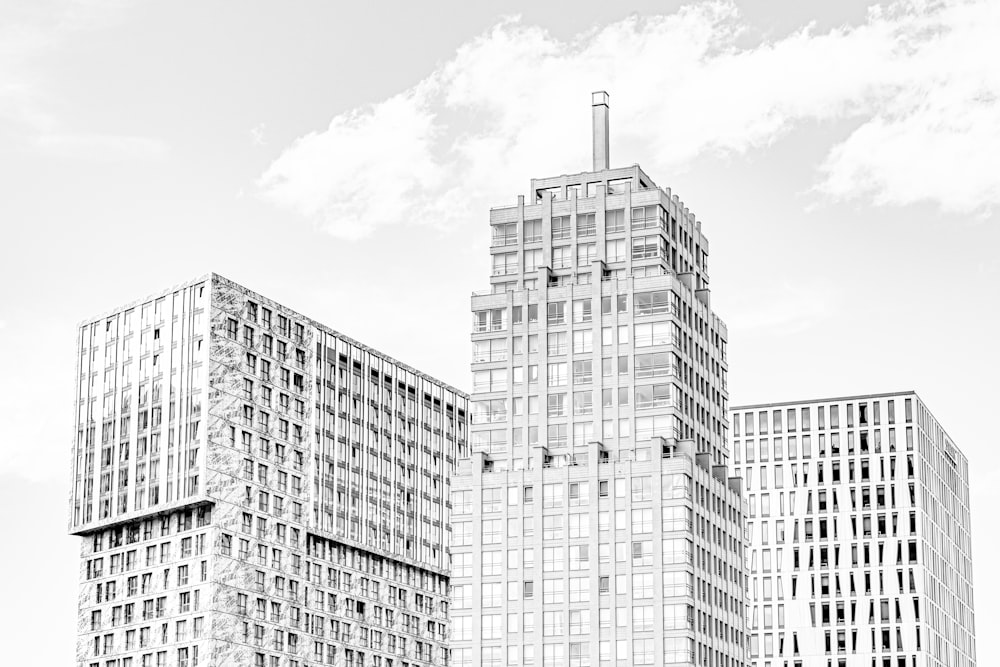 a black and white photo of some very tall buildings