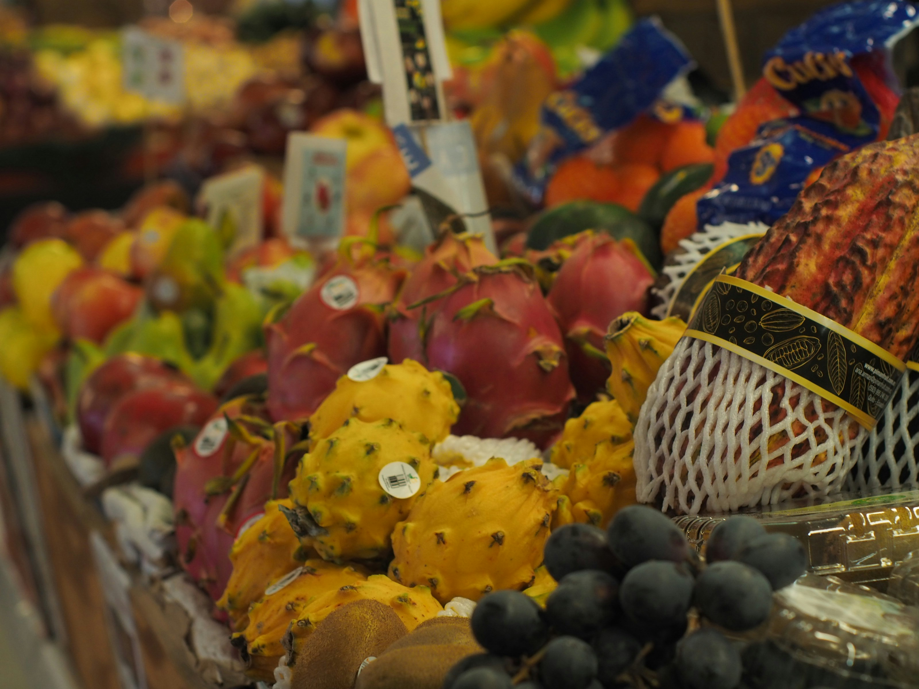 a fruit stand with a variety of fruits and vegetables