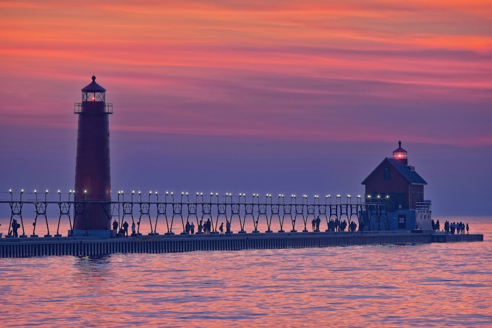 a long pier with a light house on top of it