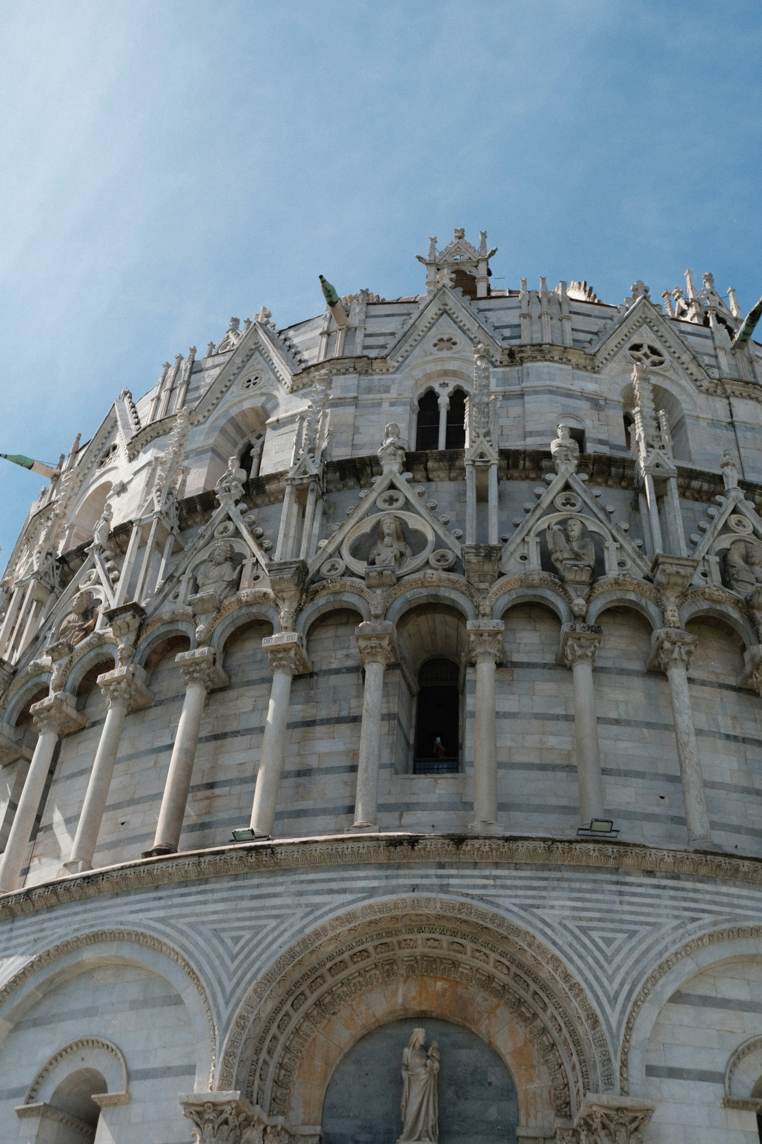 a very tall building with a clock on it's side