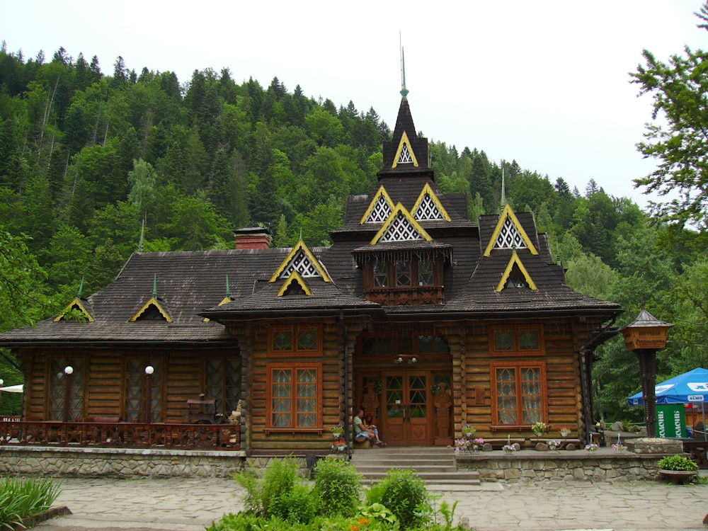 a wooden building with a clock on the top of it