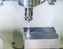 a machine that is making a piece of metal