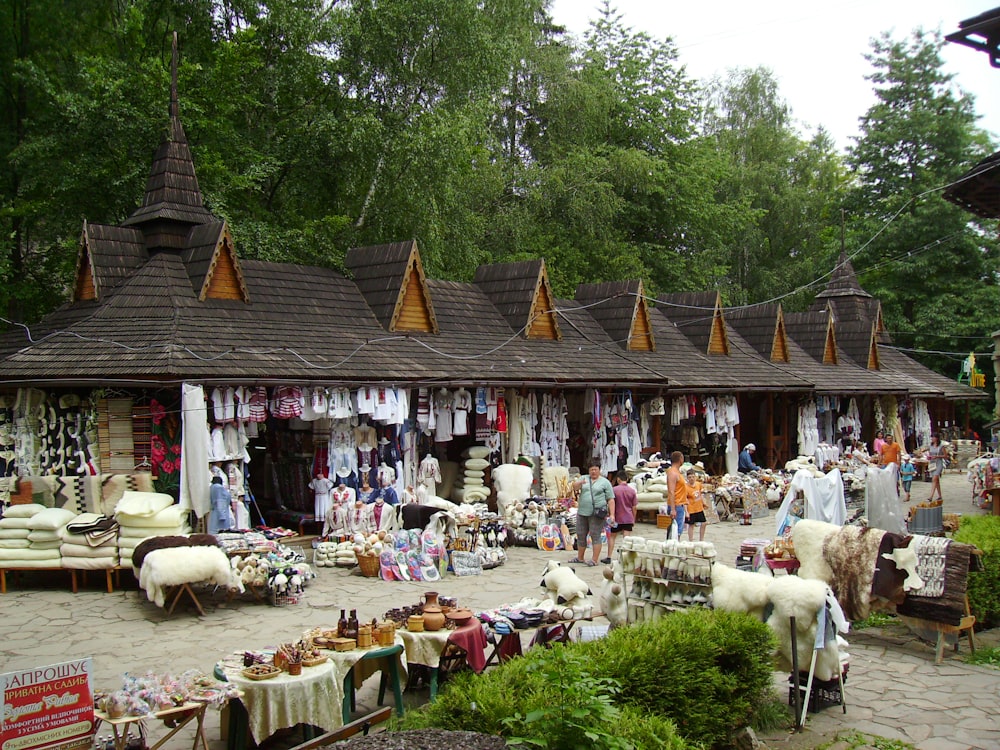 a group of people standing outside of a store