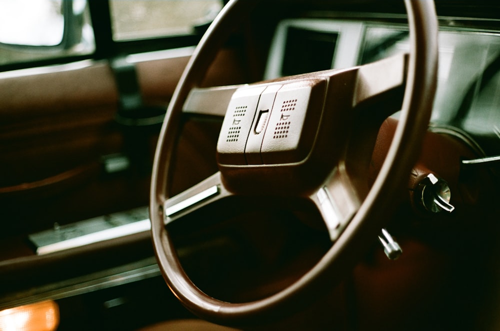 a steering wheel and dashboard of a car