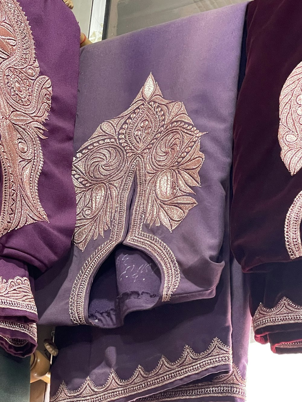 a display of purple and gold decorative items