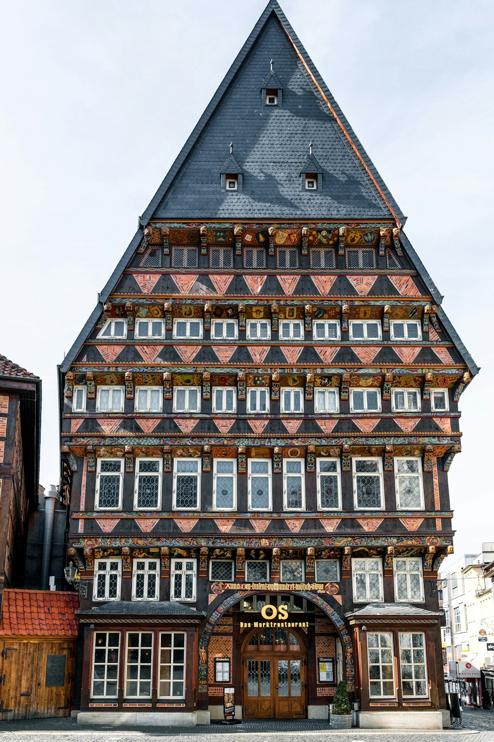 a tall building with a clock on the front of it