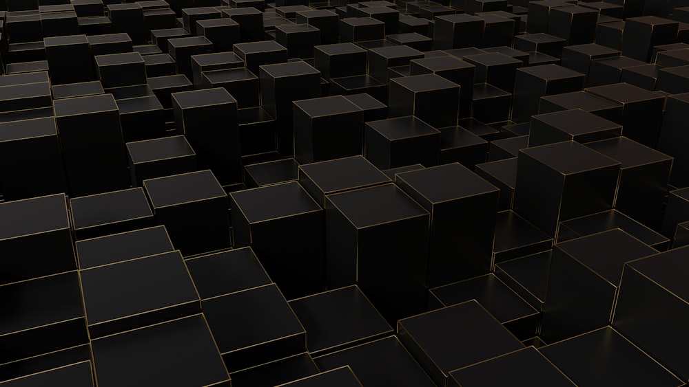 a very large group of black cubes in a room