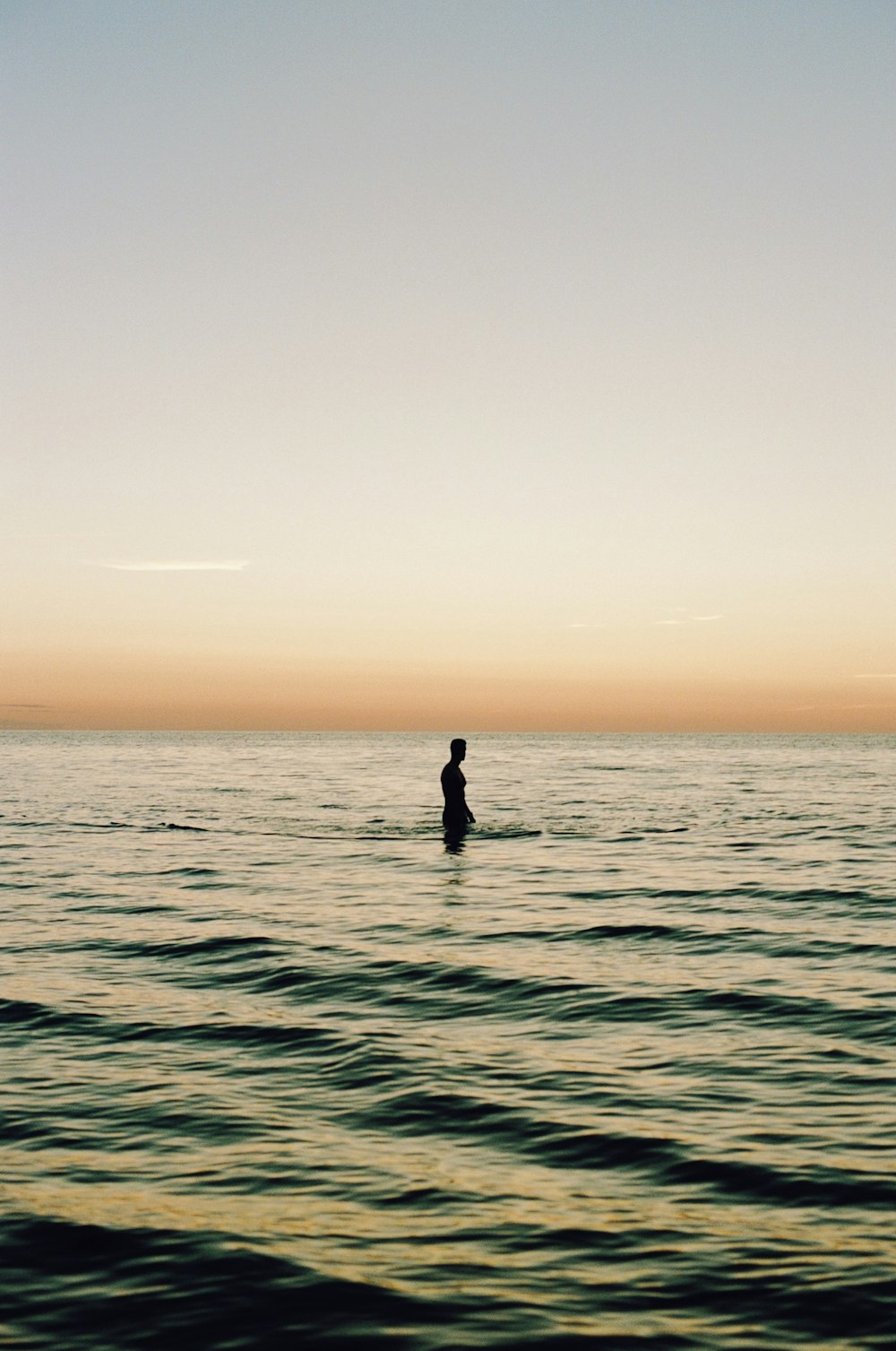 a person riding a surf board on a body of water