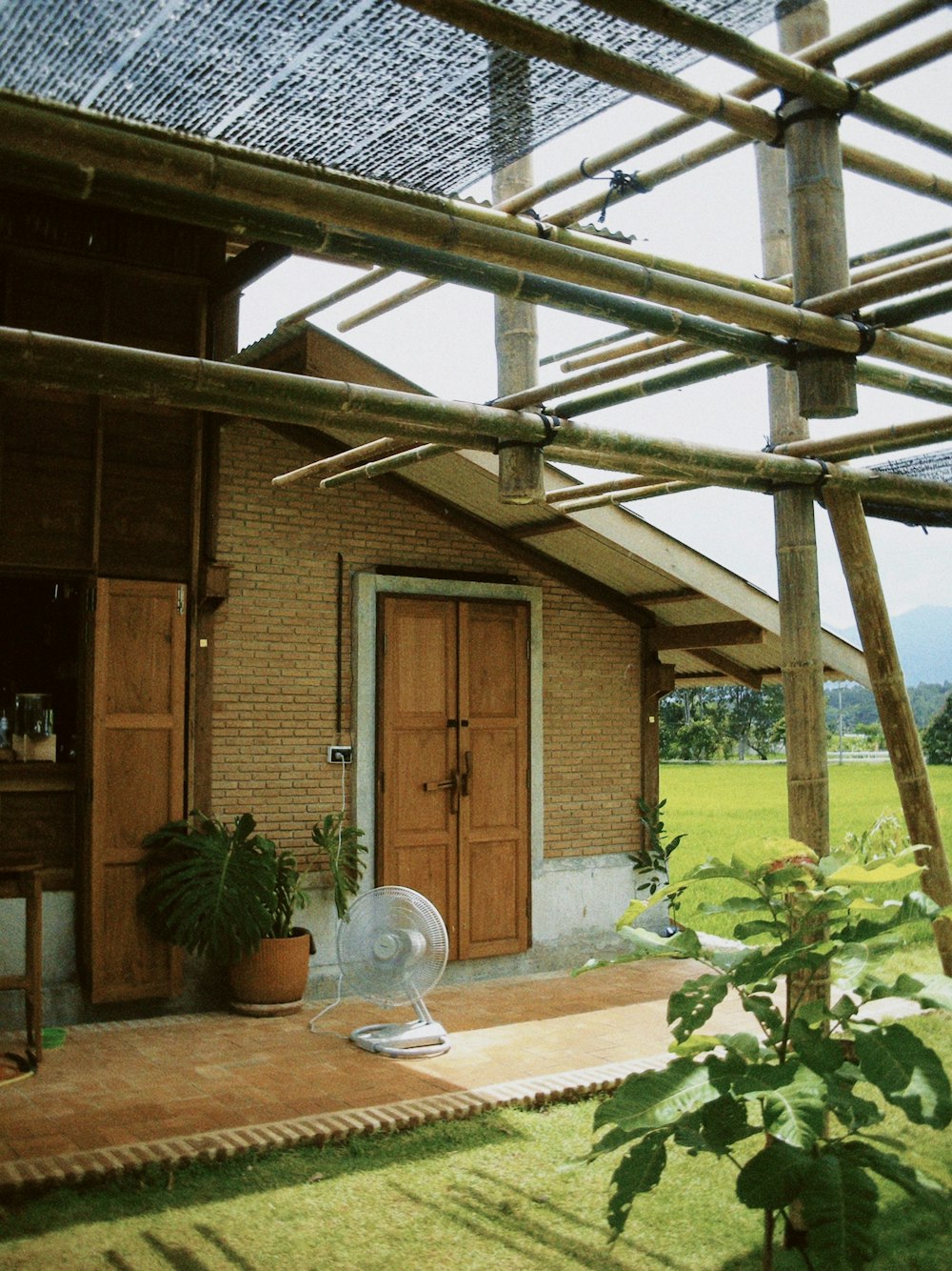 a house with a roof made of bamboo