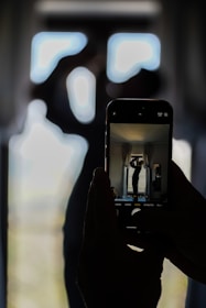 a person taking a picture of themselves in a mirror